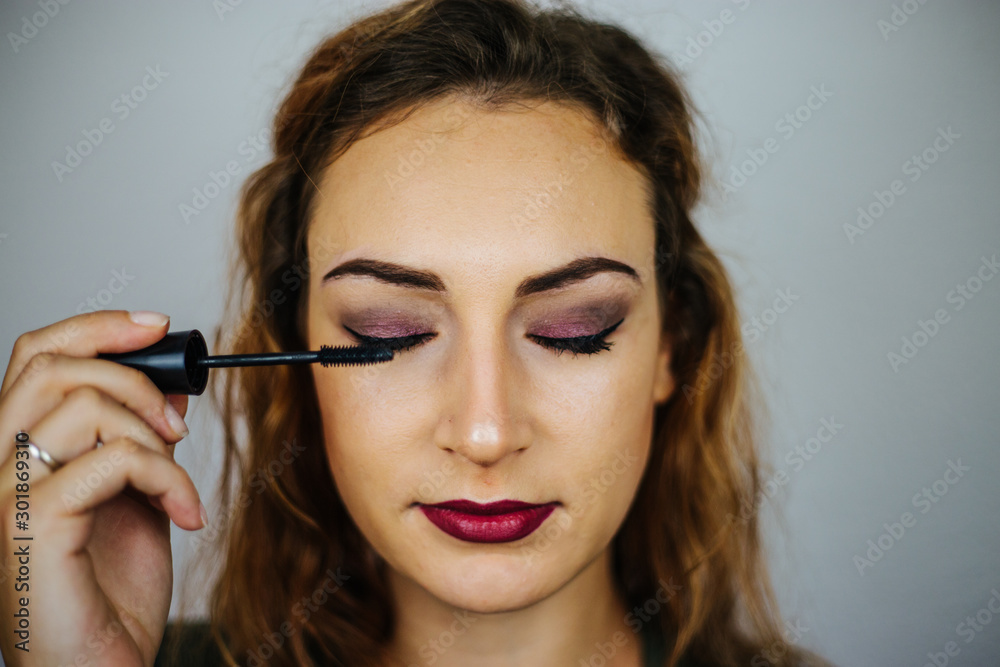 Portrait, beautiful girl, make-up, with smile posing on white background, makeup, powder, eye shadow, mascara, lipstick, eyeshadow Portrait, beautiful girl, make-up, with smile posing on white background, makeup, powder, eye shadow, mascara, lipstick, eyeshadow