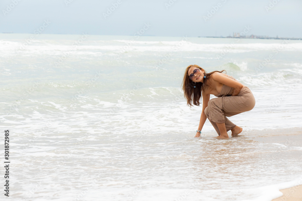 beautiful asian woman relaxing with happiness on vacation sea beach beautiful asian woman relaxing with happiness on vacation sea beach