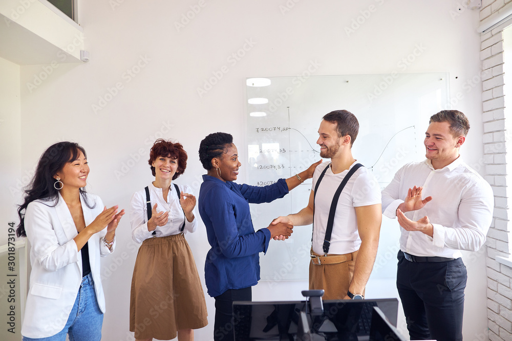 Business for people. African and caucasian business people shake hands each other, friendly partnership, team work. Colleagues applause background Business for people. African and caucasian business people shake hands each other, friendly partnership, team work. Colleagues applause background