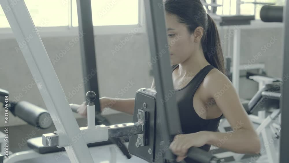 Beautiful young asian woman workout training arm in the fitness for bodybuilding in the gym, asia girl exercise for strength and strong and vigorous of muscle, healthy and wellness concept. Beautiful young asian woman workout training arm in the fitness for bodybuilding in the gym, asia girl exercise for strength and strong and vigorous of muscle, healthy and wellness concept.