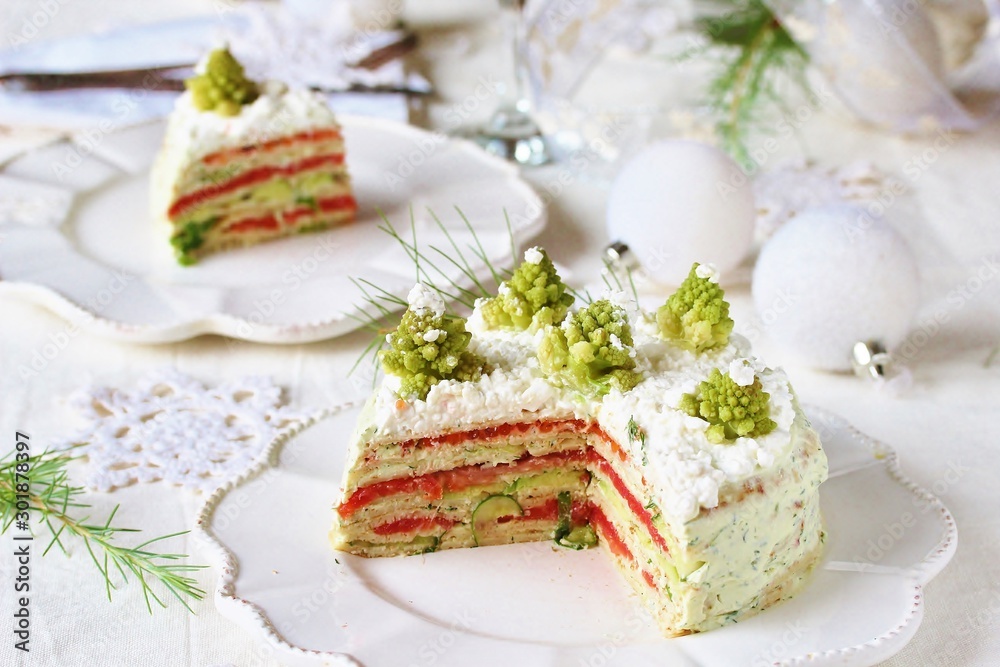 crep cake for Christmas and New Year. Christmas tree decorations cabbage romanesco. Snack cake with salmon, avocado and soft cheese. Grains of cottage cheese play the role of snowdrifts. crep cake for Christmas and New Year. Christmas tree decorations cabbage romanesco. Snack cake with salmon, avocado and soft cheese. Grains of cottage cheese play the role of snowdrifts.
