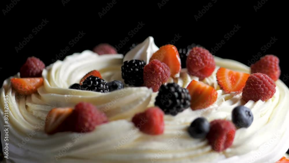 The process of making dessert Anna Pavlova with berries and cream The process of making dessert Anna Pavlova with berries and cream