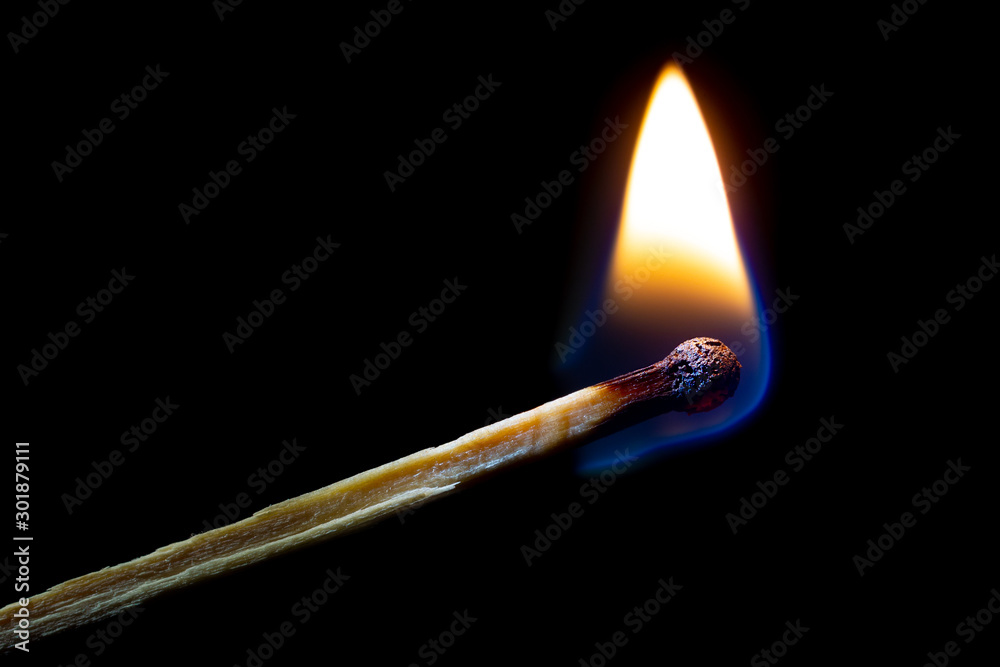 Burning match on black Burning match on black
