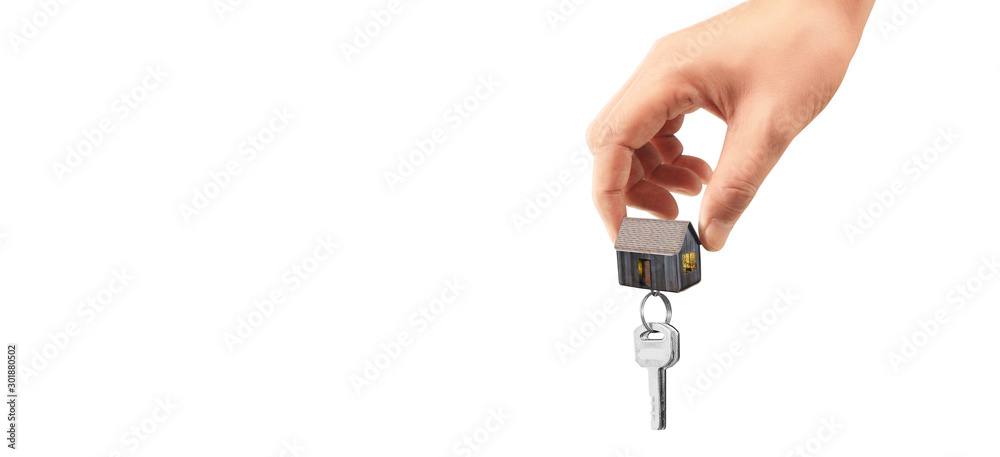 Real estate agent handing over house keys in hand Real estate agent handing over house keys in hand