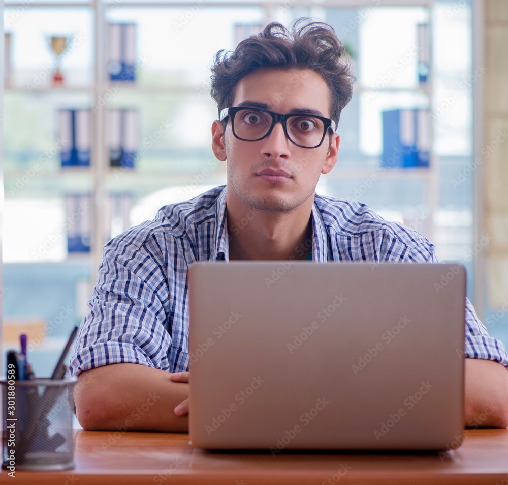 Student studying at home preparing for exam Student studying at home preparing for exam