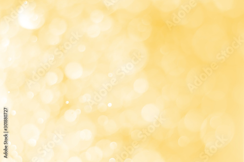 Blurred images of golden bokeh, golden bokeh circles for Christmas, Abstract.