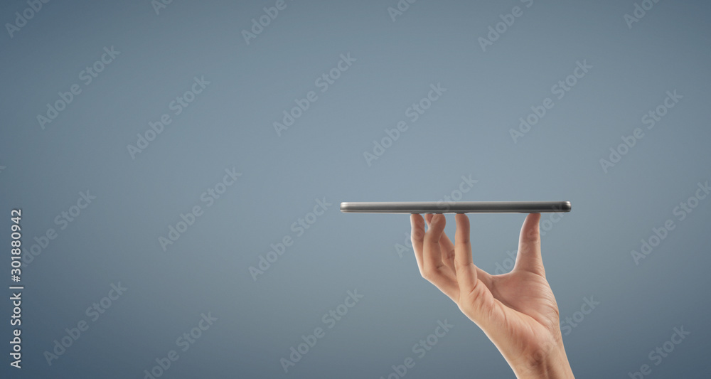 Hands holding a tablet touch computer gadget with isolated screen Hands holding a tablet touch computer gadget with isolated screen