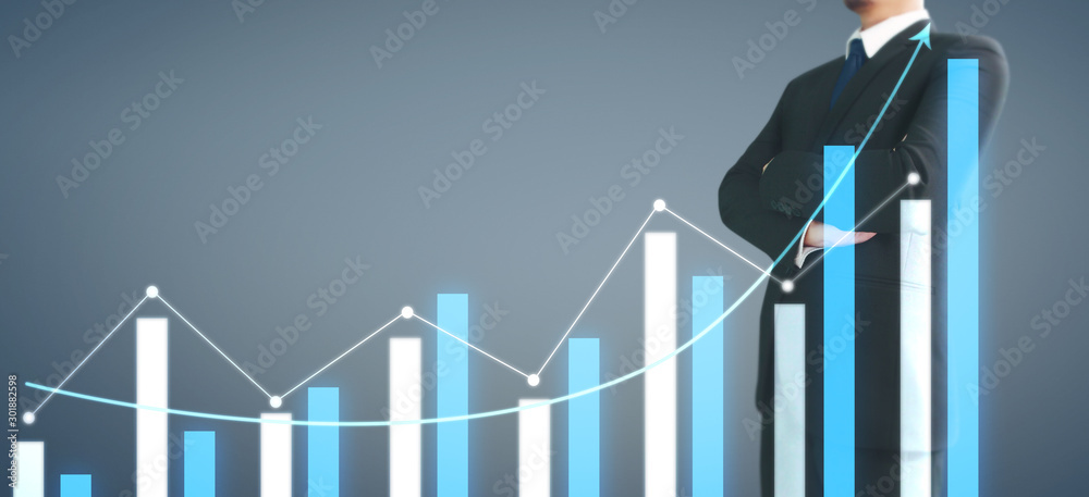Businessman plan graph growth increase of chart positive indicators in his business Businessman plan graph growth increase of chart positive indicators in his business