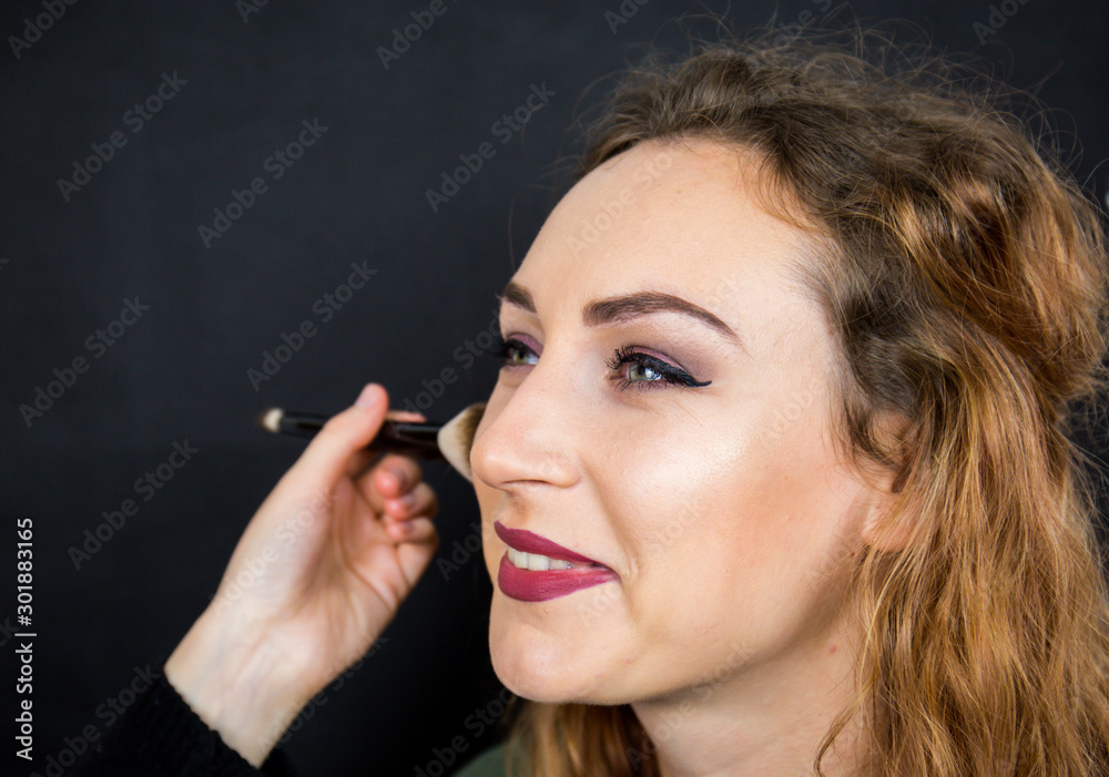Portrait, beautiful girl, make-up, with smile posing on black background, makeup, powder, eye shadow, mascara, lipstick, eyeshadow Portrait, beautiful girl, make-up, with smile posing on black background, makeup, powder, eye shadow, mascara, lipstick, eyeshadow
