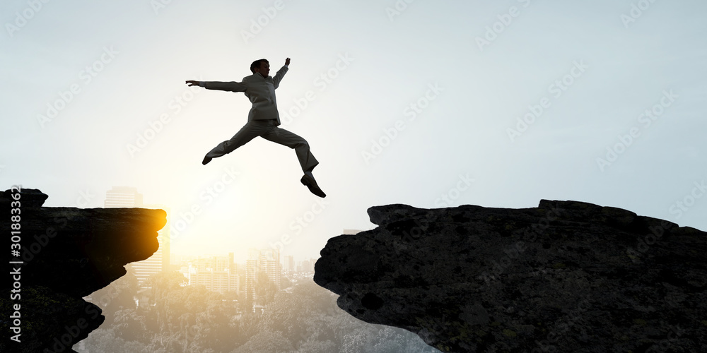 Businessman jump over leap. Mixed media - obrazy, fototapety, plakaty 