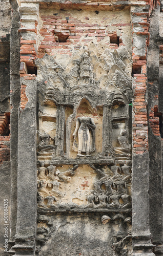 old aged ancient buddha statue, architecture wall at Ayutthaya Historical Park.