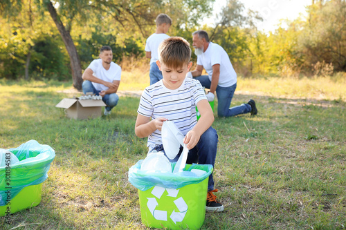 People gathering garbage ou...