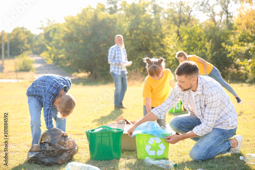 People gathering garbage ou...