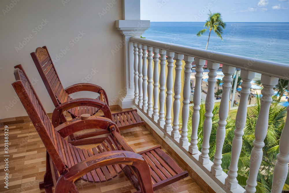 Two lounge chairs on the terrace overlooking the ocean and the beach, Phu Quoc island, Vietnam