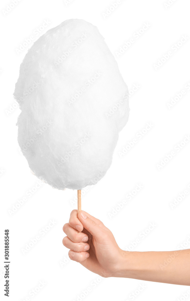 Female hand with tasty cotton candy on white background Female hand with tasty cotton candy on white background