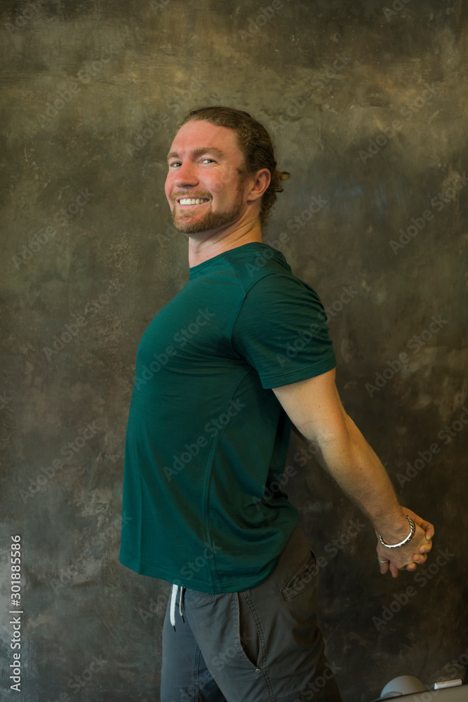 good vibes portrait of young happy and attractive red hair American man in cool hipster style smiling confident and positive stretching body before gym workout isolated good vibes portrait of young happy and attractive red hair American man in cool hipster style smiling confident and positive stretching body before gym workout isolated