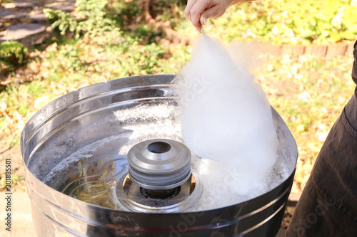 Making of sweet cotton candy outdoors