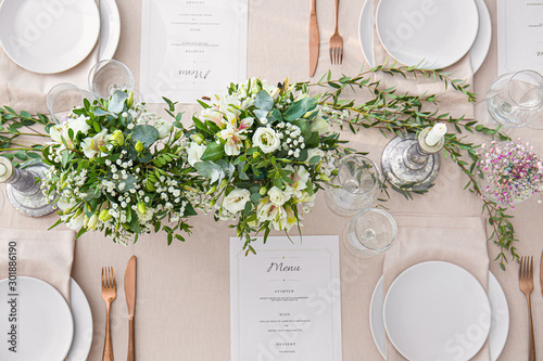 Beautiful table setting for wedding celebration in restaurant