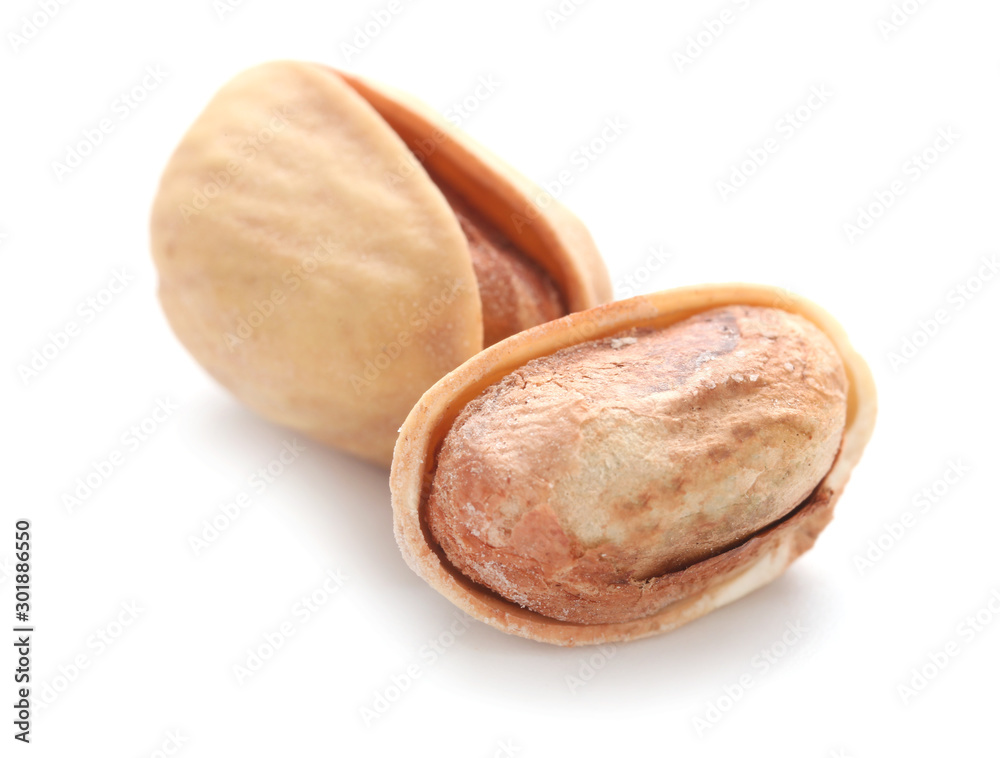 Tasty pistachio nuts isolated on white Tasty pistachio nuts isolated on white