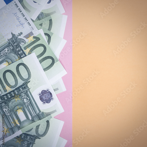 Euro cash on a yellow and pink background. Euro Money Banknotes. Euro Money. Euro bill. Place for text. photo