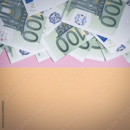 Euro cash on a yellow and pink background. Euro Money Banknotes. Euro Money. Euro bill. Place for text. photo