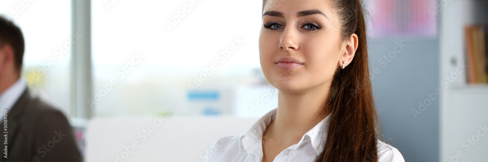 Beautiful smiling girl at workplace look in camera Beautiful smiling girl at workplace look in camera