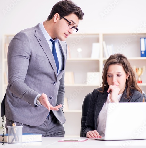 Obraz na plátně Angry boss unhappy with female employee performance