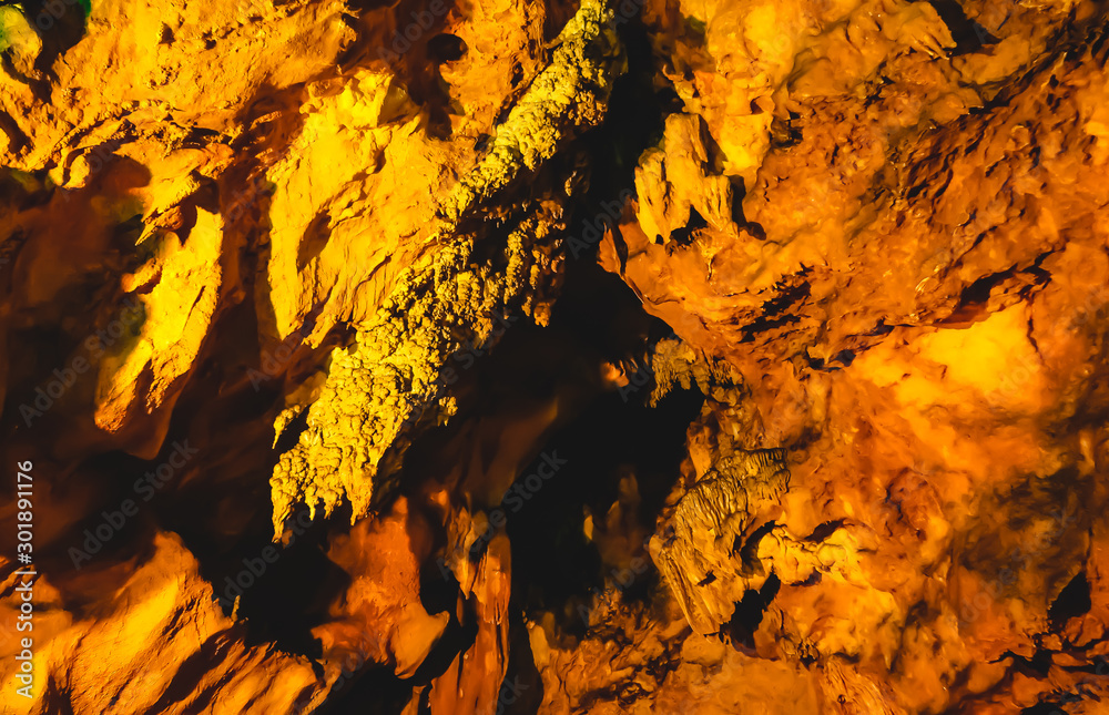 beautiful view of stalactites and stalagmites in an underground cavern. beautiful view of stalactites and stalagmites in an underground cavern.