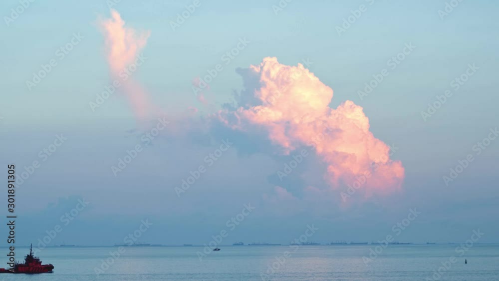 View of a passing ship near the sea shore. Shot. Beautiful view of the sea and clouds