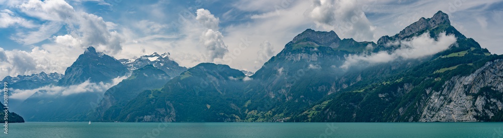 Switzerland, Panoramic view on green Swiss Alps near Isleten Switzerland, Panoramic view on green Swiss Alps near Isleten