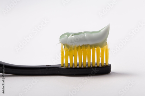 Toothpaste and toothbrush closeup. Dental care. photo