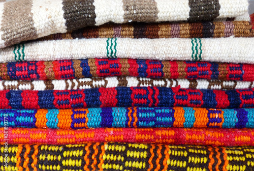 Colorful traditional ecuadorian handmade wool rugs from Loja at craft market, Ecuador