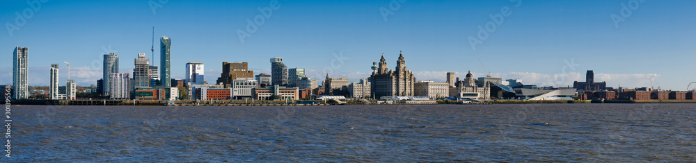 Liverpool's UNESCO listed waterfront including modern office buildings, Liverpool's Anglican Cathedral, the Three Graces and the new Museum of Liverpool.