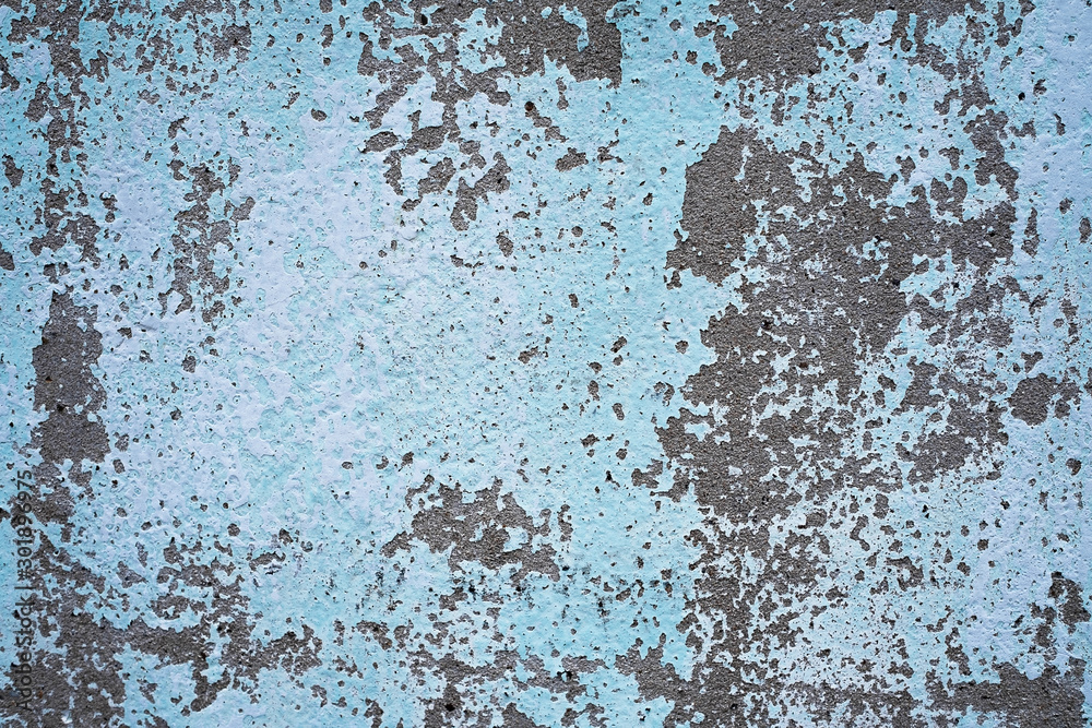 Blue cement wall Abrasives due to prolonged exposure to sunlight.