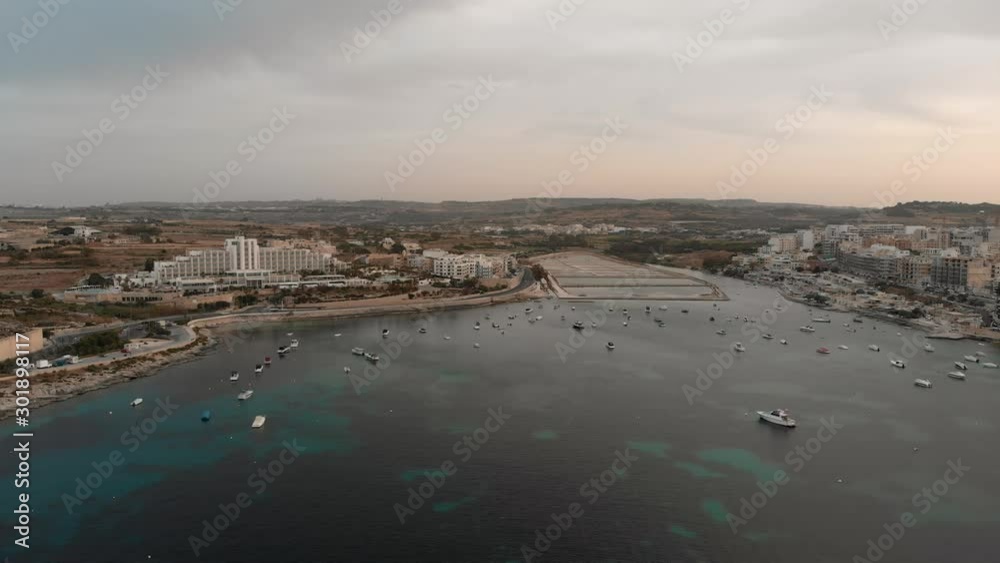 Aerial drone video from Malta, showing Qawra and Bugibba towns at sunset. MMXIX.VI.XI. Aerial drone video from Malta, showing Qawra and Bugibba towns at sunset. MMXIX.VI.XI.