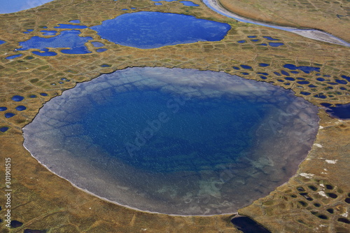 Polygonal tundra landscape in summer, Taymyr peninsula, aerial view photo
