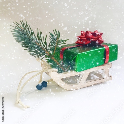 Wooden toy sledge with Christmas gifts, isolated on white
