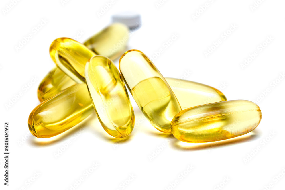 Vitamin e omega 3 fish oil yellow pills vitamins sport nutrition healthy on the white background isolated close up Vitamin e omega 3 fish oil yellow pills vitamins sport nutrition healthy on the white background isolated close up