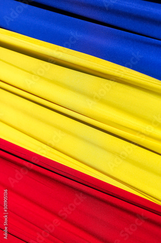 Fabric flag of Romania. Develops in the wind. photo