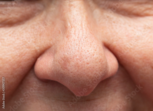woman s nose with clean fair skin