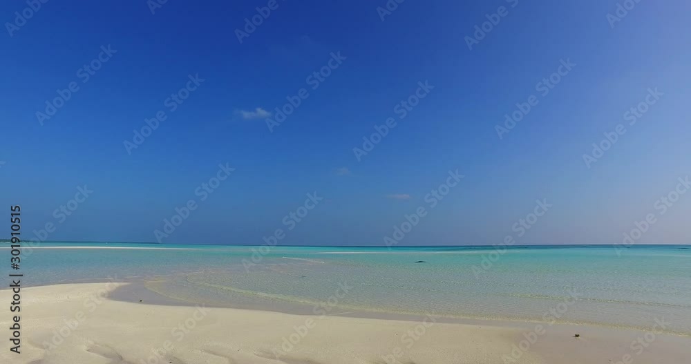 White sandy beach with turquoise waters and clear weather in the horizon, Hawaii - Static tripod White sandy beach with turquoise waters and clear weather in the horizon, Hawaii - Static tripod