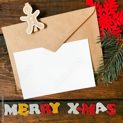 Christmas Vintage Background. Christmas decorations and greetings with shiny Merry X-Mas on an old dark wooden background. Copyspace for your text.