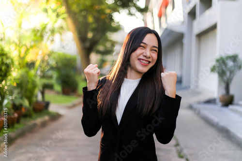 Portrait of Young beautiful Asian business woman felling happy or success working.