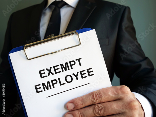 Exempt employee sign is in the hands.