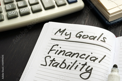 Personal goal - financial stability inscription on the sheet. photo