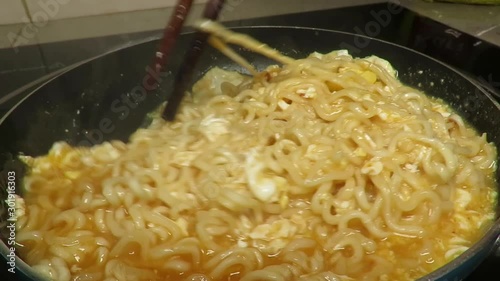 Cooking spicy Malaysian style Instant noodle or ramen photo