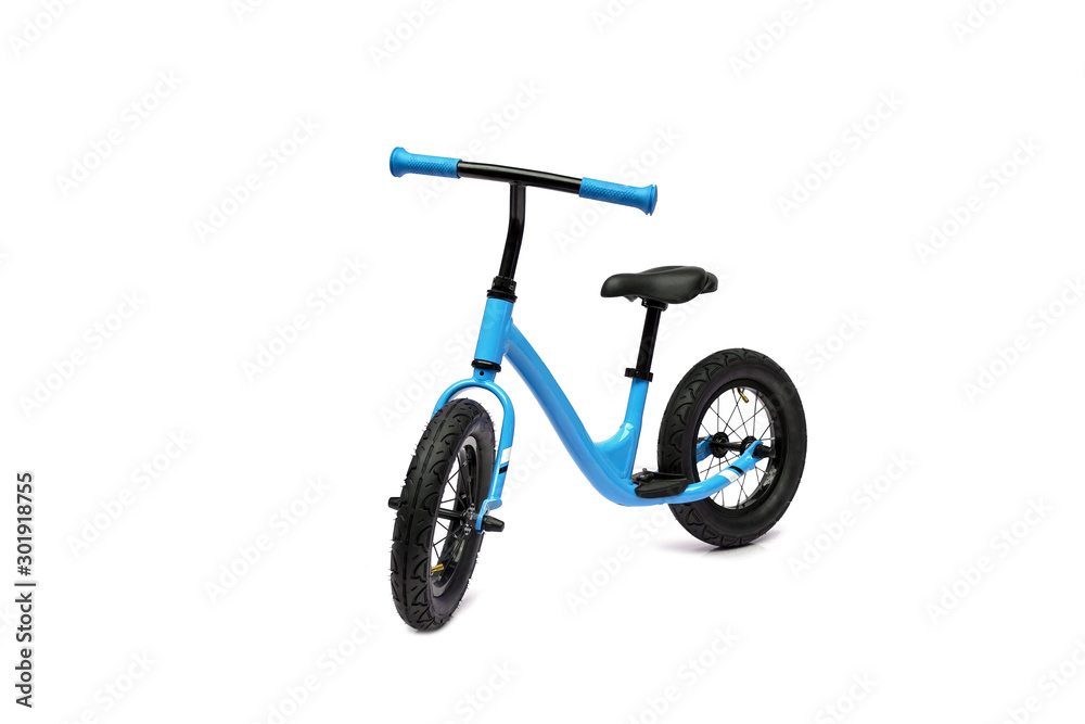 A pink balance bike isolated on white background A pink balance bike isolated on white background