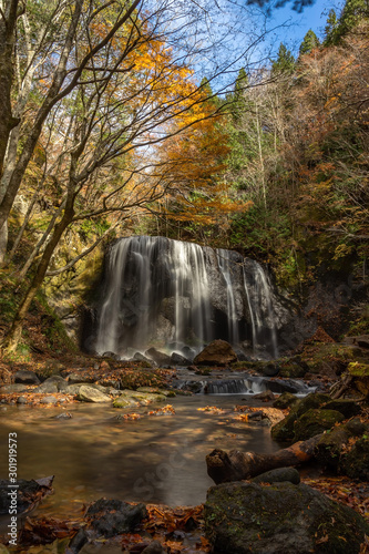 Tatsuzawafudo waterfall in autumn Fall season at Fukushima. There is the waterfall in inawashiro, Fukushima, Japan. photo