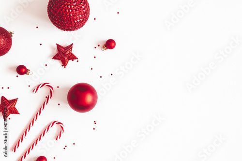 Christmas composition. Red decorations on white background. Christmas, winter, new year concept. Flat lay, top view, copy space