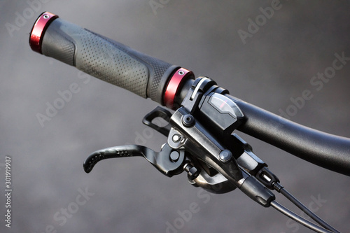 Closeup of bicycle brake lever and gear shifter photo